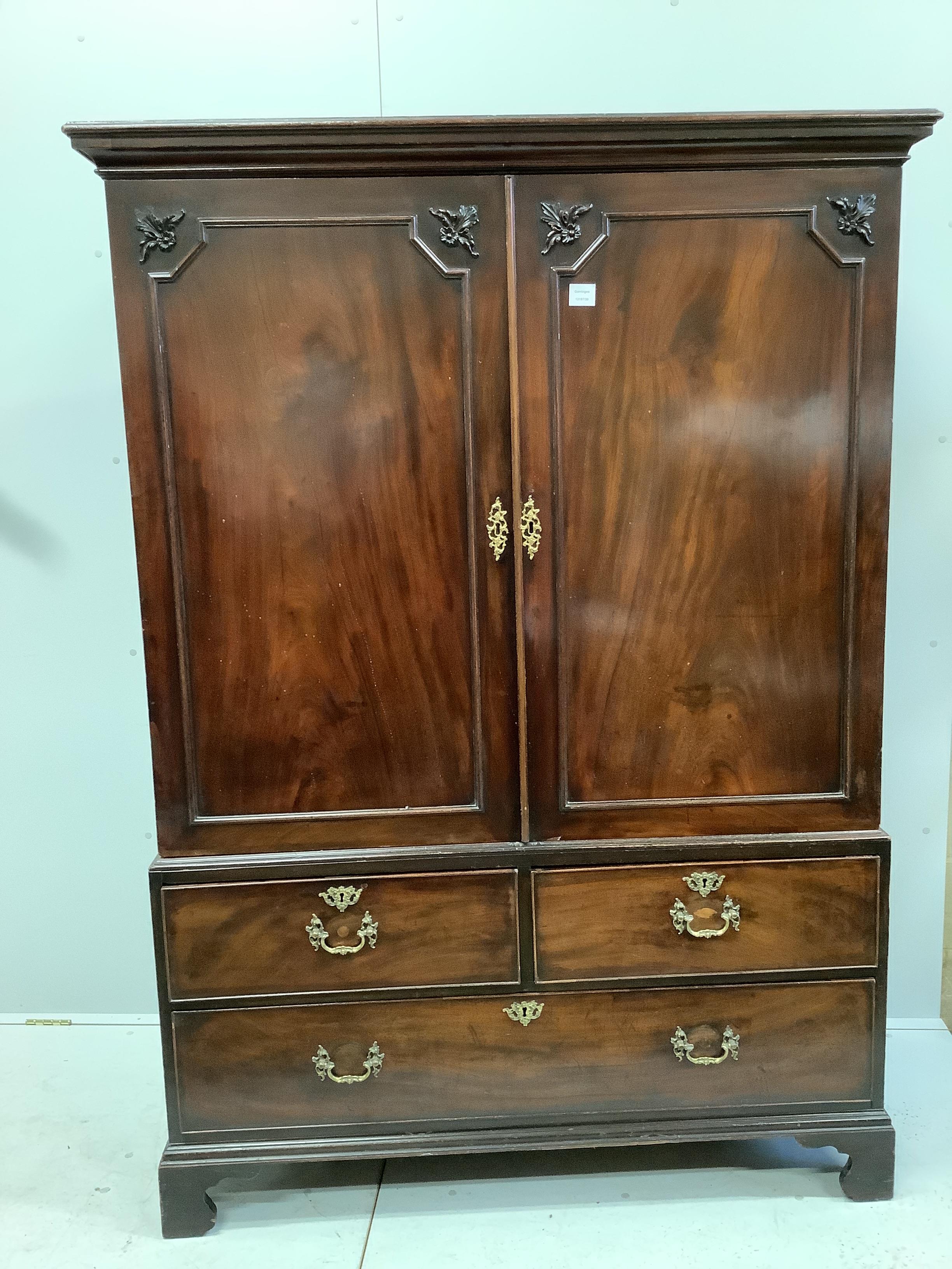 A George III mahogany press cupboard, width 130cm, depth 58cm, height 183cm